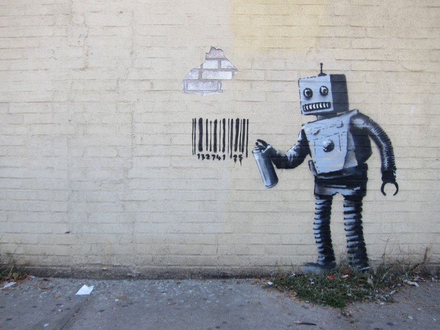 street mural of a robot painting a barcode